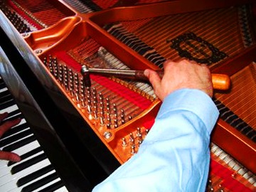 Two free tunings included with a used piano
